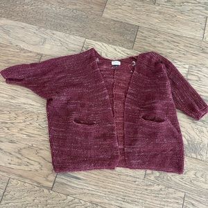 Maroon and cream colored 3/4 sleeve cardigan.